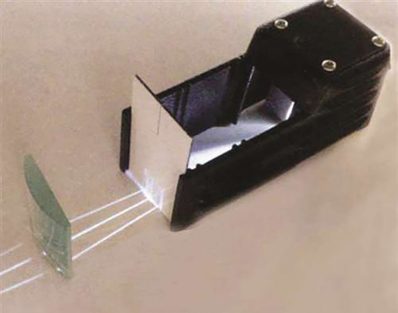 Ray box and converging lens for ray tracing activity.