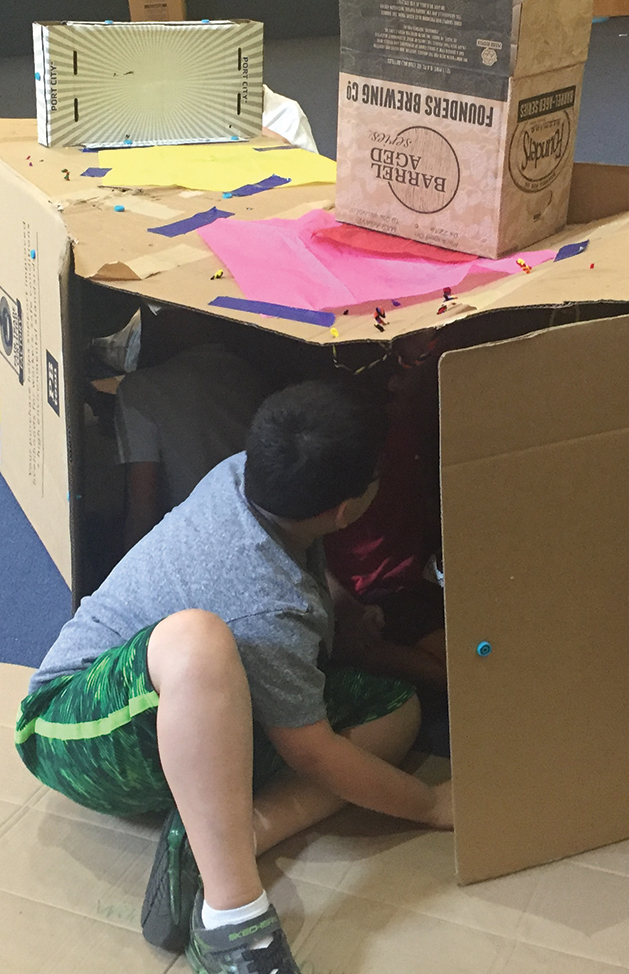 Firecrackers and forts—children find many uses for cardboard.