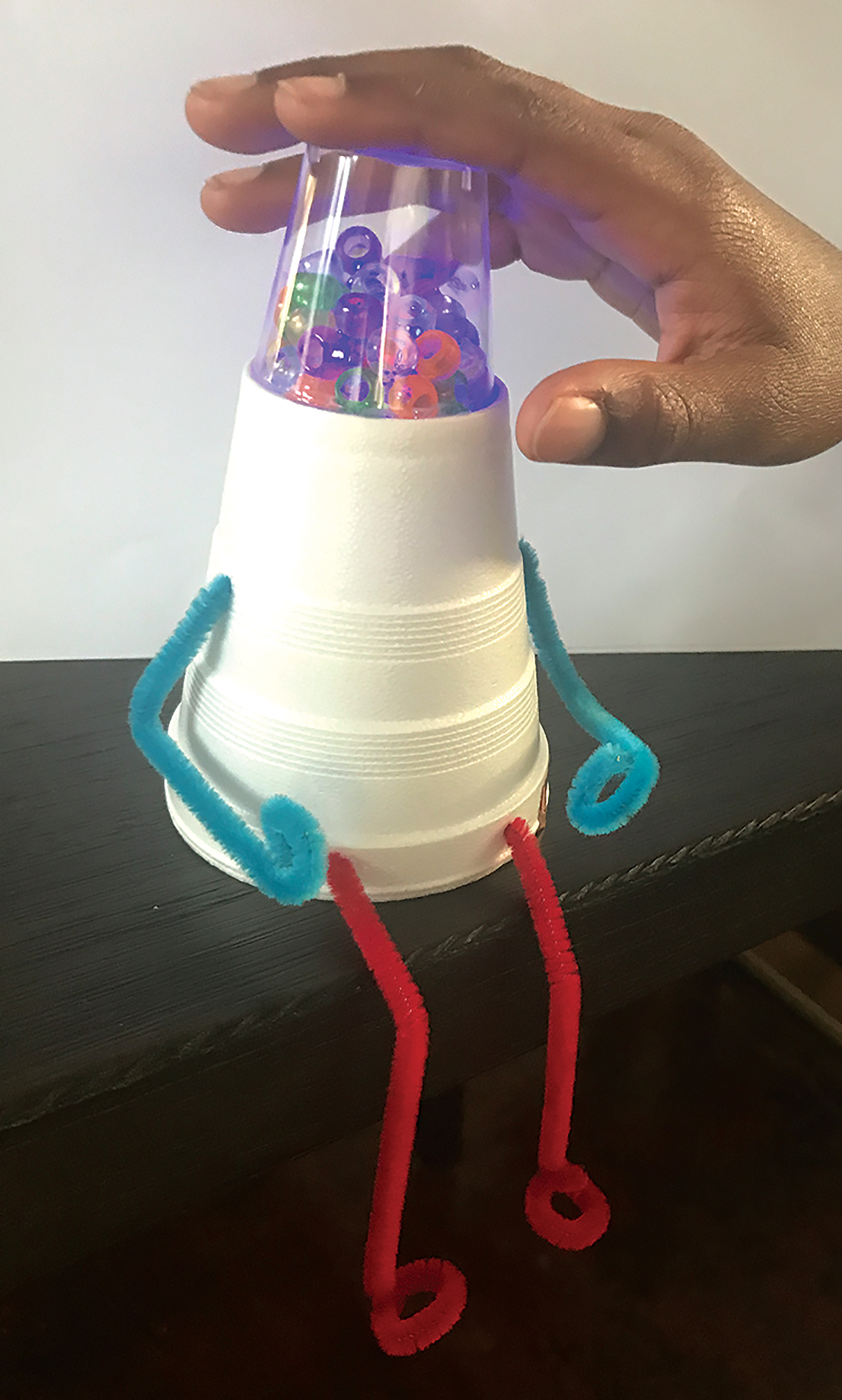A Styrofoam cup robot ready for service.