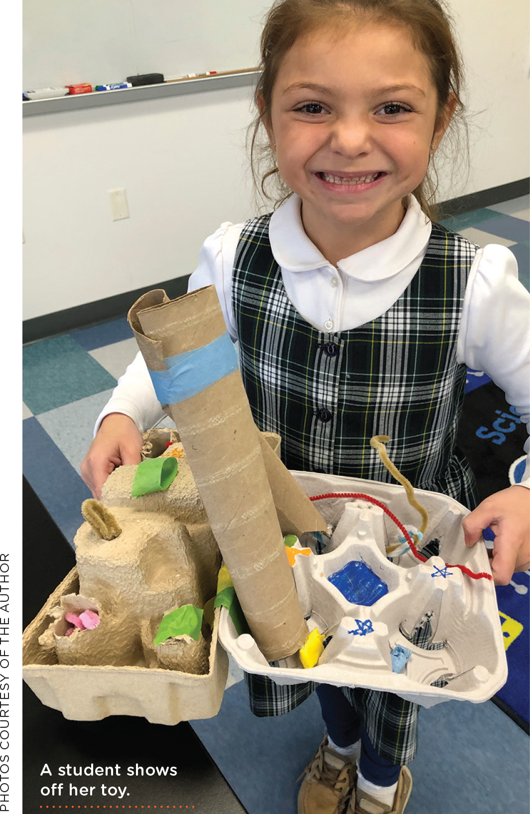 A student shows off her toy.