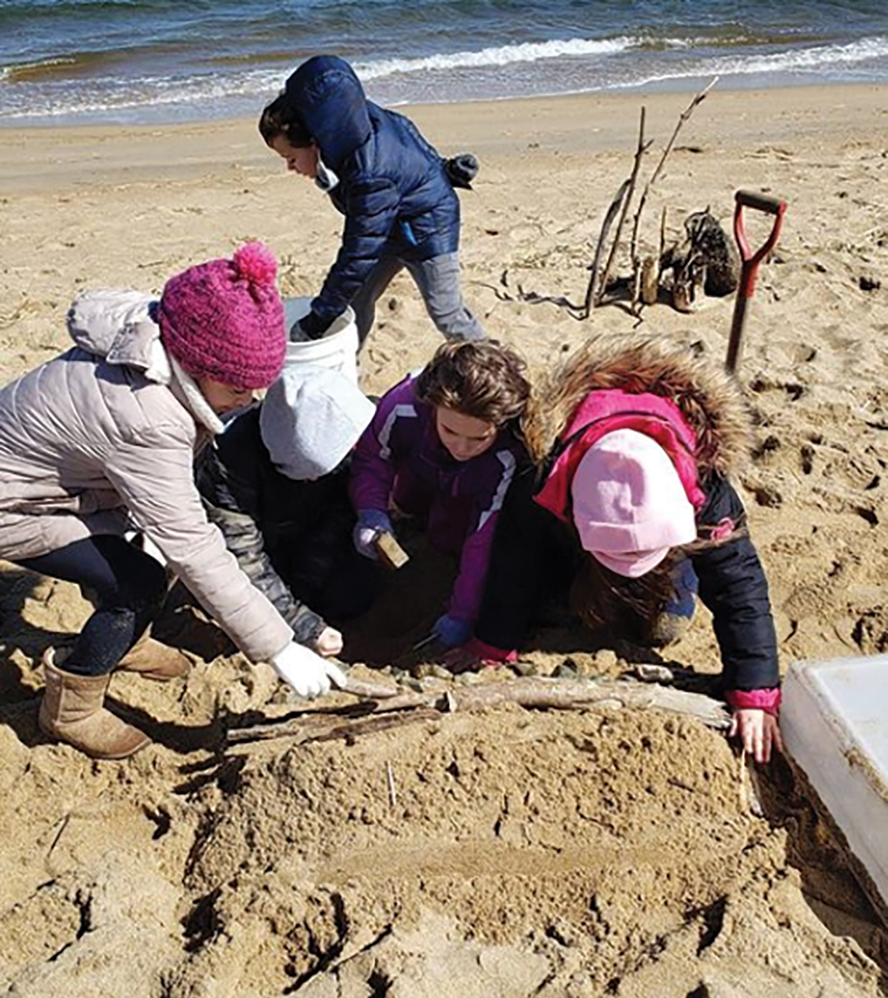 Students develop their model sea barrier during their coastline investigation