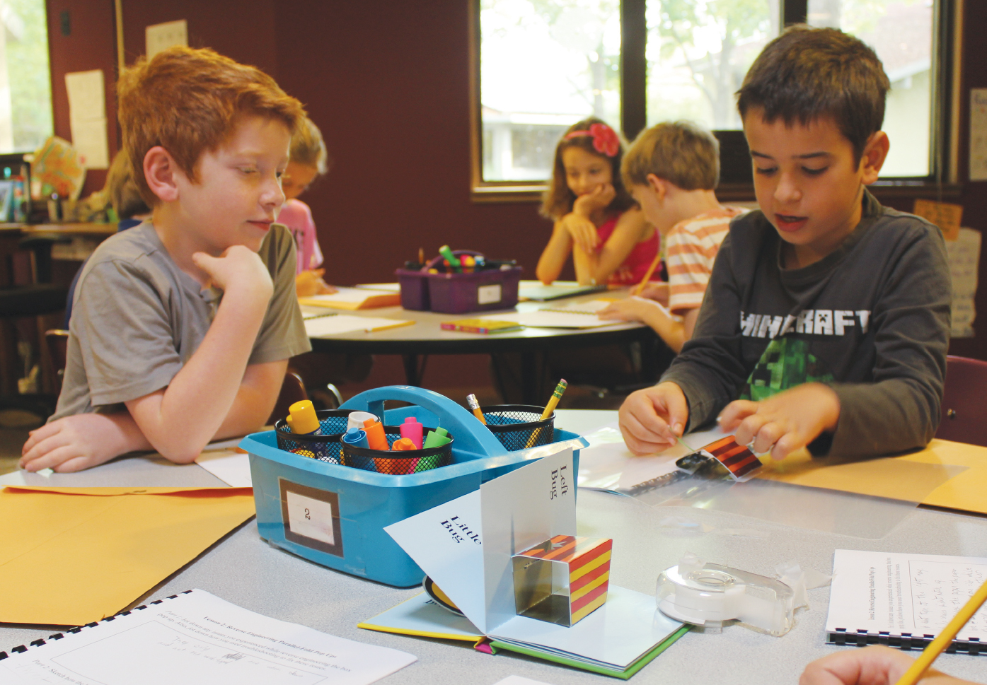 Students troubleshoot their reverse-engineered pop-up.