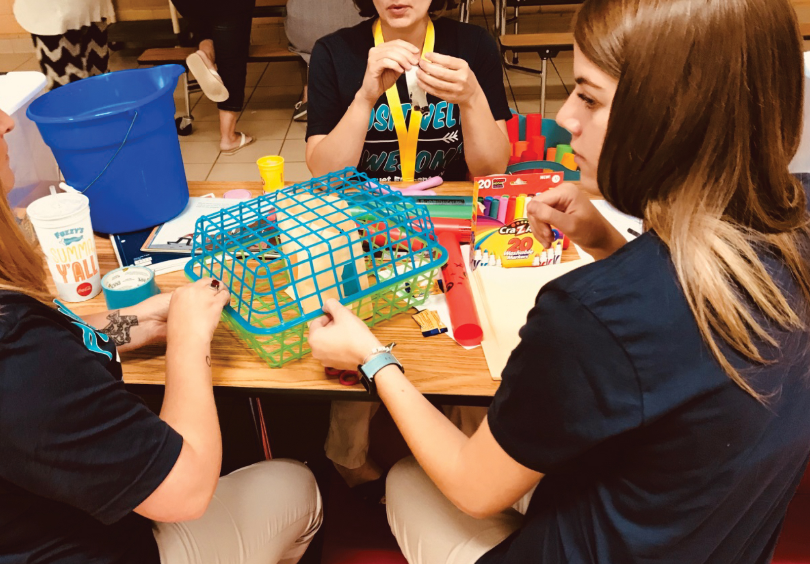 A teacher team used miscellaneous materials to engineer a trash collection and transportation system.