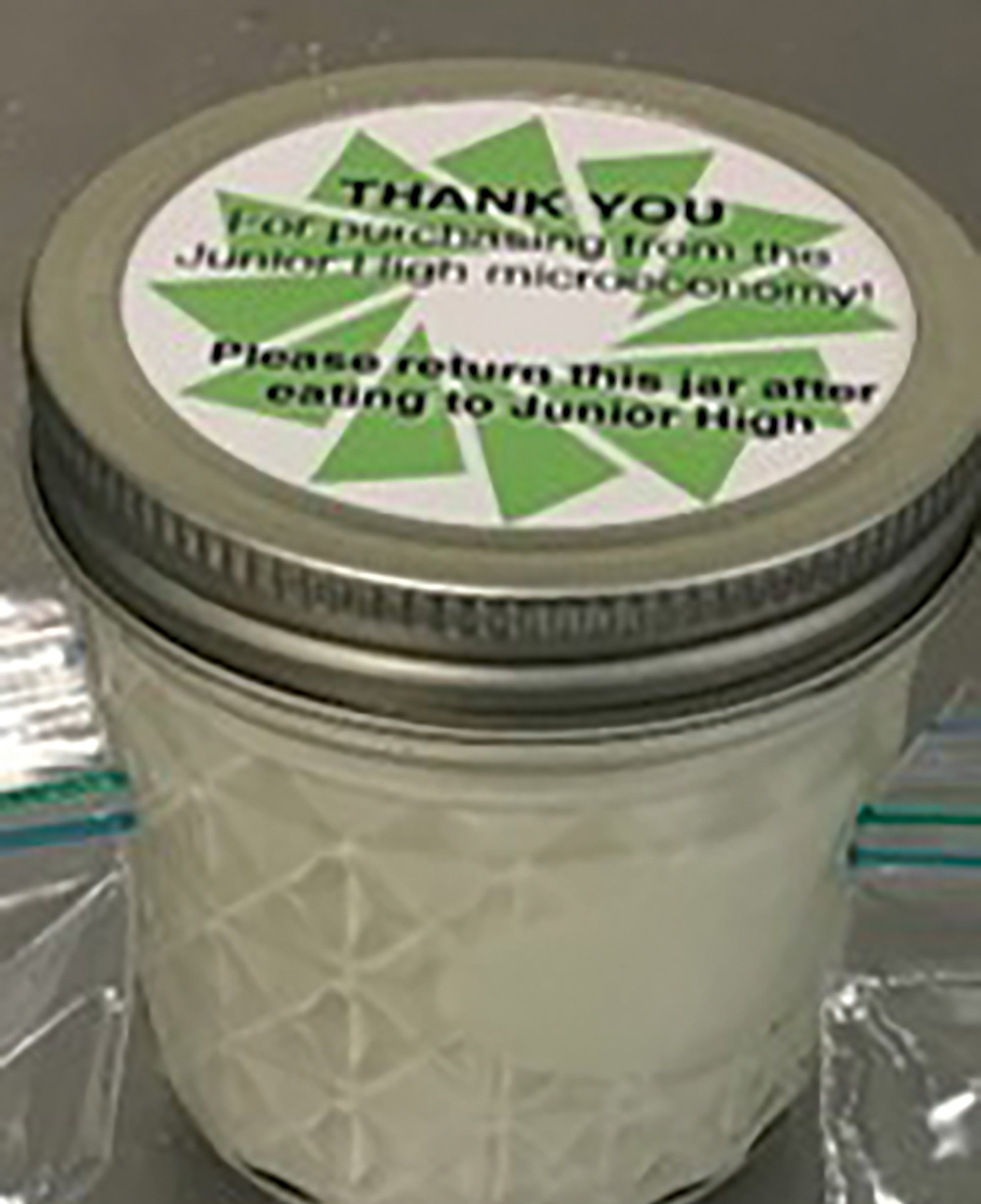 A jar of the final packaged and labelled yogurt product for sale.