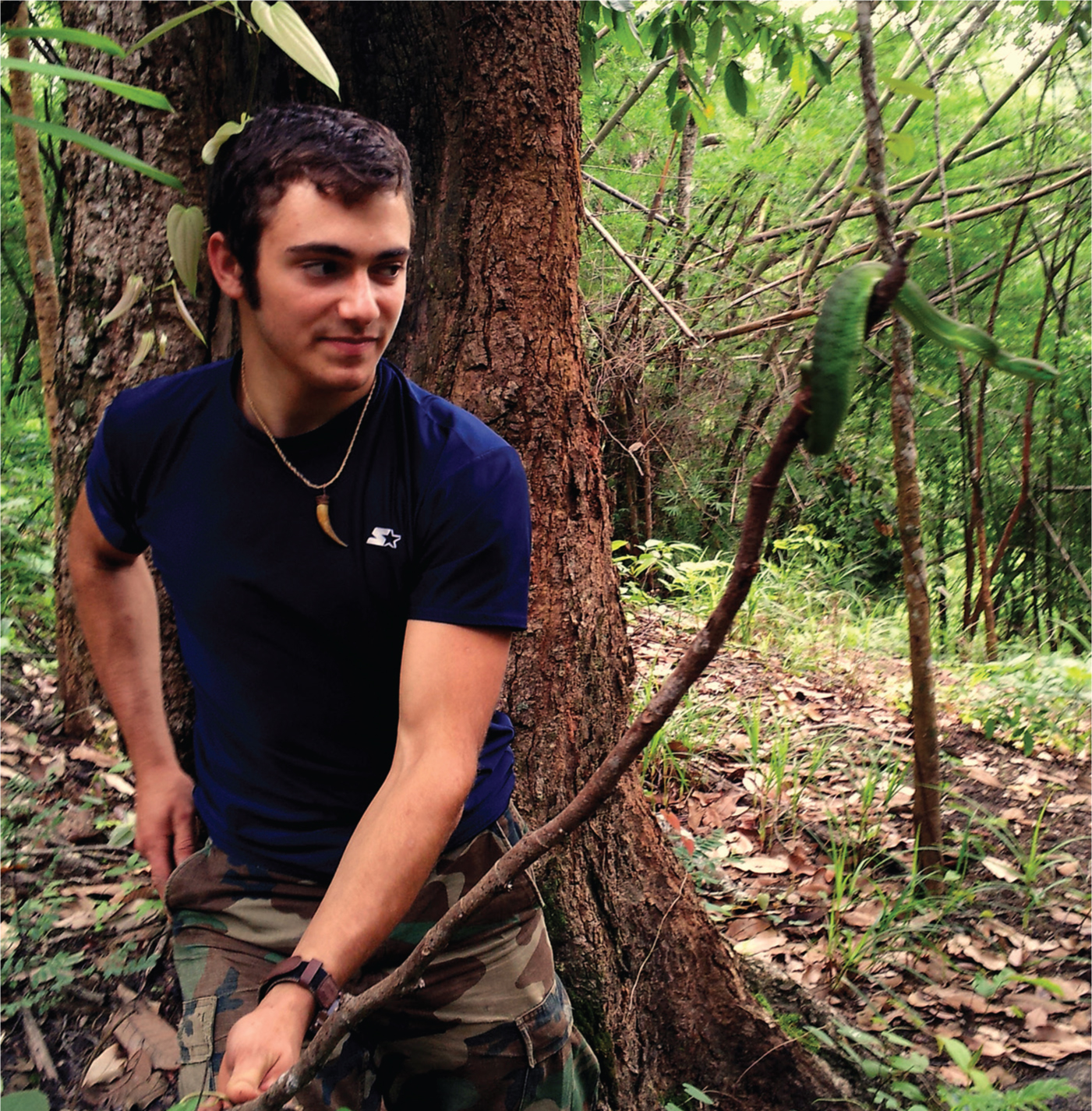 Todd Elliott with a green bamboo viper in Northern Thailand. Photo: Yelei Feng.