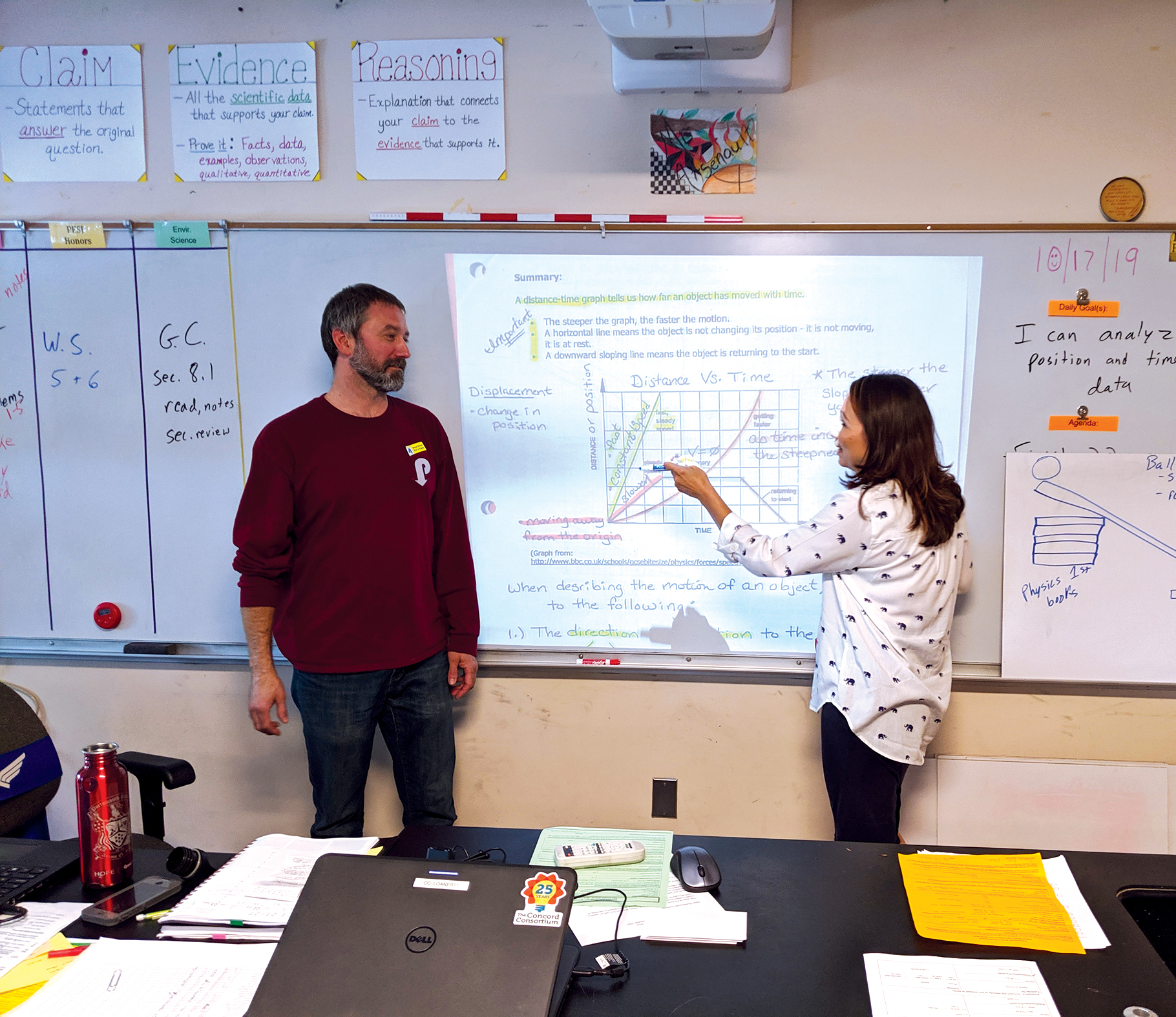 Co-teachers JP Arsenault and Michelle Murtha work together in front of the class.