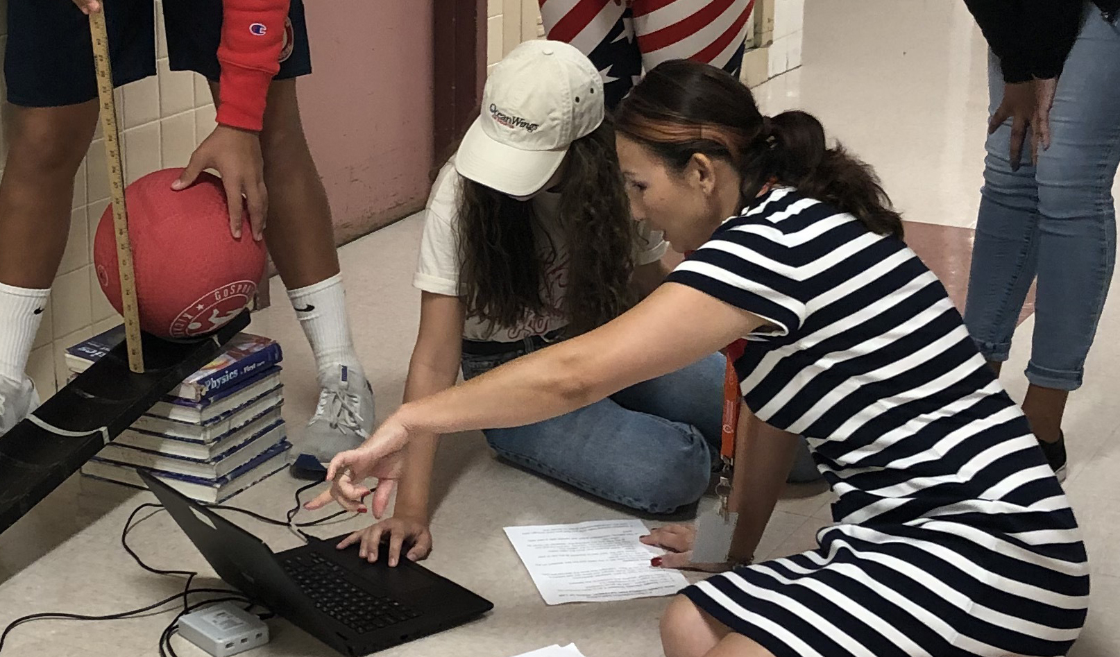 Co-author Michelle Murtha works with a lab group as they determine their experimental setup.