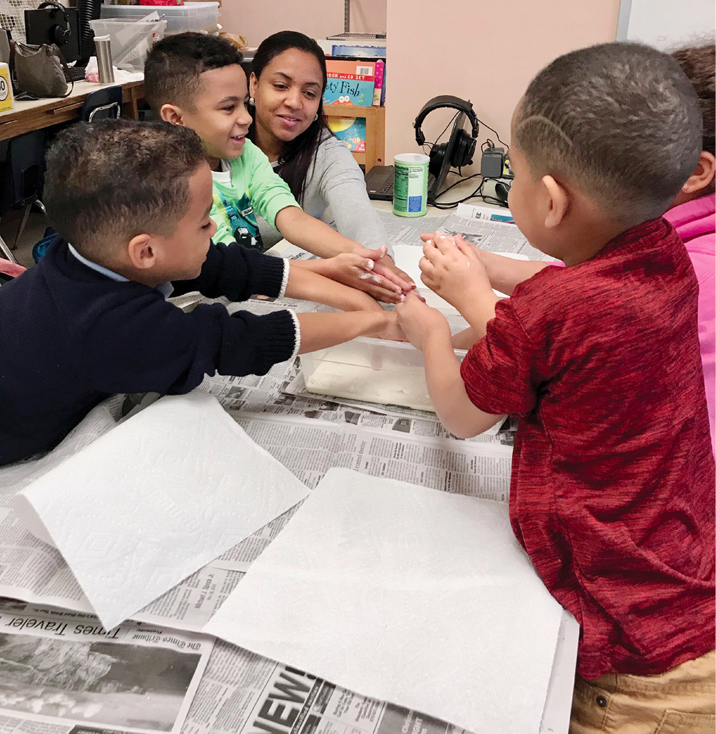 Figure 2 A mother joins in to explore Oobleck.